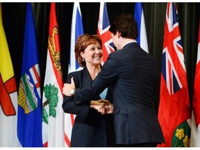 Prime Minister Justin Trudeau greets Premier Christy Clark at a First Ministers meeting in Ottawa last fall. Both levels of government have launched studies into the impact of foreign ownership on the housing market.