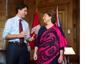 Prime Minister Justin Trudeau and B.C. Premier Christy Clark speak at the start of a meeting on Parliament Hill in Ottaw on Friday. Clark says she discussed hydro and transit projects in the province that need federal funding.