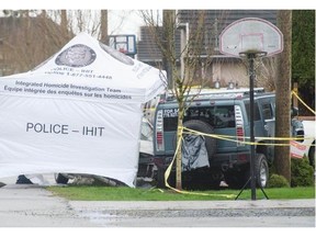 RCMP and the Integrated Homicide Investigation Team investigate a suspicious death Saturday in the 7900-block 123A Street in Surrey. A vehicle crashed into a front yard Friday night, and an injured man inside who was taken to hospital has since died.