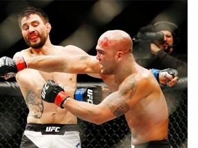 Robbie Lawler, right, fights Carlos Condit during a welterweight championship mixed martial arts bout at UFC 195 on Saturday night in Las Vegas. — The Associated Press