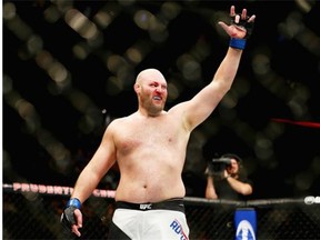Ben Rothwell celebrates his second-round submission win by guillotine choke against Josh Barnett in their heavyweight bout during the UFC Fight Night event at the Prudential Center in January.