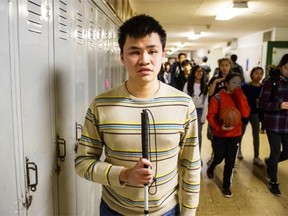 Ryan Chou, a student at Killarney Secondary School in Vancouver, says having the same notes and workbooks at the same time as his sighted peers has been paramount for a successful school experience.   Steve Bosch/PNG