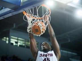 Ryan Ejim of the Carleton Ravens dunks against the Dalhousie Tigers during semifinal CIS men’s national university basketball championship action in Vancouver on Saturday.