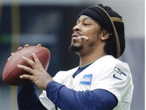 Seattle Seahawks running back Marshawn Lynch, holding a candy cane in his mouth at practice this week, has recovered from abdominal surgery last November.