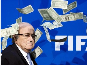 Sepp Blatter looks on after a protester threw fake U.S. dollar bills at him during a FIFA news conference last July at the world headquarters of Soccer’s governing body in Zurich.