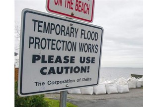 Signs and sandbags make the waterfront in Delta.    Gerry Kahrmann/PNG