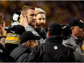 Ben Roethlisberger #7 of the Pittsburgh Steelers is tested for a concussion on the sideline in the fourth quarter against the Baltimore Ravens during their AFC Wild Card game at Heinz Field on January 3, 2015 in Pittsburgh, Pennsylvania.