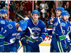 Bo Horvat #53 of the Vancouver Canucks is congratulated after scoring against the Carolina Hurricanes during their NHL game at Rogers Arena January 6, 2016 in Vancouver, British Columbia, Canada. Vancouver won 3-2. (Photo by Jeff Vinnick/NHLI via Getty Images)