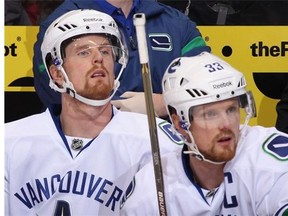 Daniel Sedin (left) will have to try to eclipse Markus Naslund's Canucks goal mark without the aid of his brother Henrik.