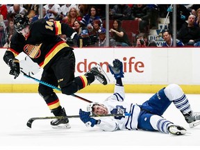 Alexandre Burrows #14 of the Vancouver Canucks skates away after checking Frank Corrado #20 of the Toronto Maple Leafs during their NHL game at Rogers Arena February 13, 2016 in Vancouver, British Columbia, Canada.
