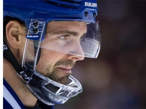 Vancouver Canucks' Dan Hamhuis looks on during a stoppage during first period NHL hockey action against the San Jose Sharks, in Vancouver on Sunday, Feb. 28, 2016.