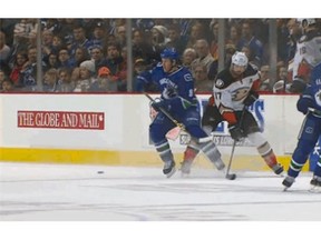 A screen grab of the moment when the Ducks' Ryan Kesler checks the Canucks' Brandon Prust. Prust is now out of the lineup with an injury.