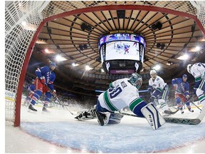 Henrik Sedin #33 of the Vancouver Canucks gets injured during the game against the New York Islanders at the Barclays Center on January 17, 2016 in Brooklyn borough of New York City.