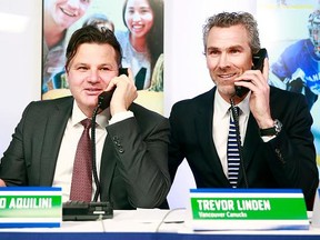 Francesco Aquilini (left) and Trevor Linden.