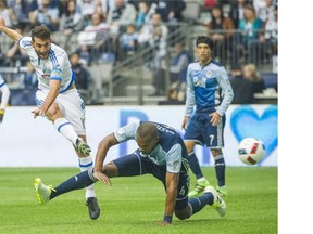Whitecaps Kendall Waston, right can't stop Montreal Impact Ignacio Piatti, left from scoring the first goal during the first half of a regular-season MLS match at BC Place Stadium in Vancouver, B.C. Sunday March 6, 2016.