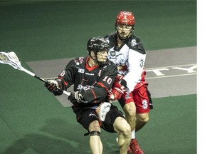 Vancouver Stealth Rhys Duch battles Calgary Roughnecks in Lacrosse action at Langley Events Centre in Langley, B.C., on May 2, 2015.