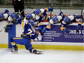 Kathleen Cahoon and her UBC teammates celebrate a goal in their semi final win over Calgary in the CIS women's hockey semi finals on Saturday.