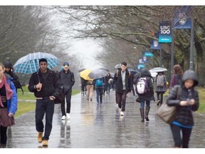 Students walk along the mail mall at UBC in Vancouver, Thursday, Jan. 21, 2016. It's unlikely B.C. students will see the same sort of tuition relief Ontario students have been promised.