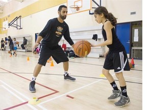 SURREY January 28 2016. Surinder Grewal teaches young basketball players at the AthElite Basketball Camp Surrey, January 28 2016.  Gerry Kahrmann  /  PNG staff photo) / PNG staff photo) ( For Prov Sports ) 00041405A Story by Jose Colorardo