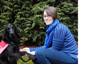 Tessa Hawkins and her service dog Merlot in Victoria on Thursday. Hawkins said she faces job discrimination because she needs Merlot with her 24/7 because she has epilepsy. — Scott Clare