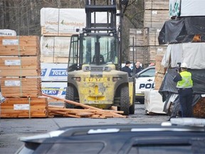 The scene of a double fatality industrial accident Saturday, Jan 23, when a load of lumber fell on two workers.