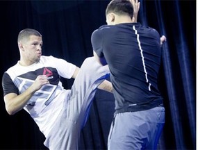 In this photo taken, Wednesday, March 2, 2016, Nate Diaz kicks during open workouts for UFC 196 at MGM Grand in Las Vegas. Diaz takes on UFC featherweight champion Conor McGregor in UFC 196 on Saturday. (Steve Marcus/Las Vegas Sun via AP) LAS VEGAS REVIEW-JOURNAL OUT; MANDATORY CREDIT