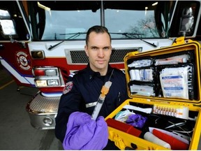 Vancouver firefighter Jonathan Gormick displays a naloxone kit.
