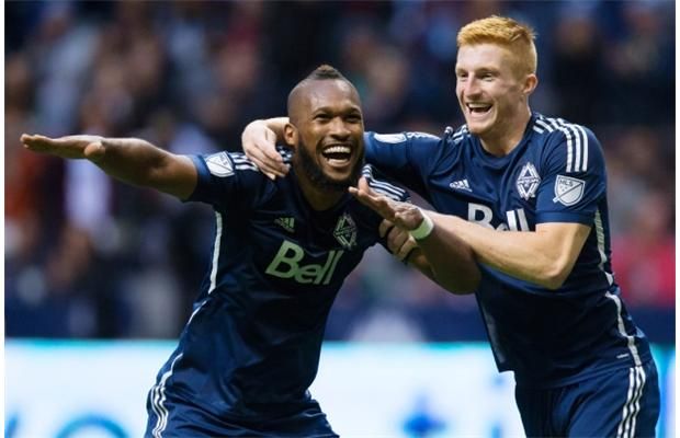 Vancouver Whitecaps centre-backs Kendall Waston, left, and Tim Parker celebrate Waston’s goal.