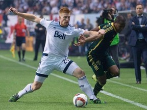 Vancouver Whitecaps fullback Tim Parker fights for control of the ball with Darlington Nagbe of the Portland Timbers during the second half their game at B.C. Place in November.