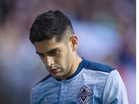 Vancouver Whitecaps’ Matias Laba leaves the field after receiving a red card during the first half of an MLS soccer game against the Los Angeles Galaxy in Vancouver, B.C., on Saturday April 2, 2016.