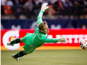 The Vancouver Whitecaps re-signed goalkeeper David Ousted on Tuesday, bolstering one of the best defensive units in MLS.