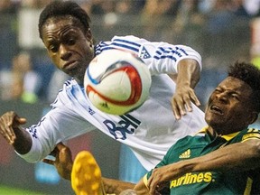 Vancouver Whitecaps striker Darren Mattocks, left, battles for the ball with Portland Timbers midfielder Dairon Asprilla during last year’s Western Conference semifinal match at B.C. Place. The two will now face off on the practice field, after the Whitecaps traded Mattocks to Portland, where Mattocks starred for current Timbers coach Caleb Porter at the University of Akron.
