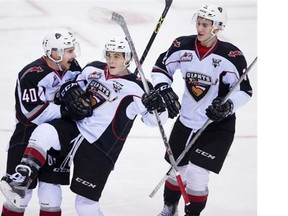 What Vancouver Giants teammates Ty Ronning (centre) and Trevor Cox (left) lack in size, they make up for with the ability to score. The Canucks could surely use some of that.