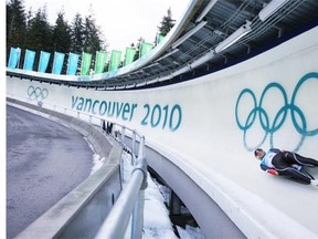 German luge athlete Tatjana Huefner blasts down the The Whistler Sliding Centre course during training in Whistler, BC at the 2010 Vancouver Olympic Games, Sunday February 14, 2010.  The track has extensive security measures to prevent the sort of trespass that led recently to deaths on the sliding track Calgary Olympic Park.