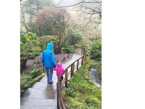 A two-year-old Metis girl at the heart of a court fight between her foster parents and the B.C. government walks with her foster father in Butchart Gardens, in an image provided by the foster mother, in Victoria, B.C. in January 2016.