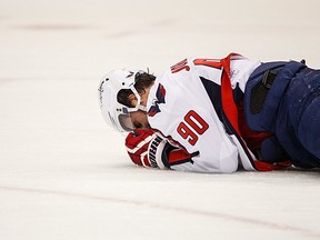 Washington's Marcus Johansson lies on the ice after a late head shot from Pittsburgh's Kris Letang in Game 3.