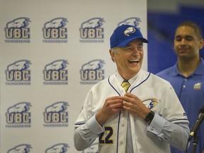UBC's new athletic director Gilles Lepine steps up for his first at-bat, donning 'Birds baseball togs at his introductory press conference Friday at Doug Mitchell Arena. (Arlen Redekop, PNG)