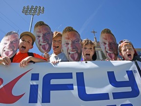 Fans wave Phil Mackenzie  'Fat Heads' at Torero Stadium, home to PRO Rugby San Diego.