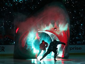 Joe Thornton and Joe Pavelski emerge from the jaws before last night's Game 3 win.