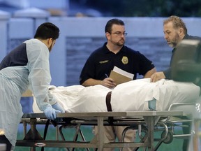 A body of one of the victims arrives at the Orlando Medical Examiner's Office , Sunday, June 12, 2016, in Orlando, Fla. A gunman opened fire inside a crowded gay night club early Sunday, before dying in a gunfight with SWAT officers, police said. (AP Photo/Alan Diaz) ORG XMIT: FLAD112