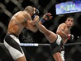 Anthony Pettis kicks Edson Barboza during a lightweight mixed martial arts bout at UFC 197, Saturday, April 23, 2016, in Las Vegas. (AP Photo/John Locher) ORG XMIT: NVJL120