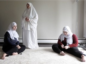 BURNABY, BC., June 20, 2016 -- Syrian refugees Hoda (l) and Maha Al-Sidawi with their mother Fayza Al-Sidawa, in Burnaby, BC., June 20, 2016. The sisters are disabled and it has been difficult to access the medical system without a family doctor. (Nick Procaylo/PNG)   00043806A    [PNG Merlin Archive]