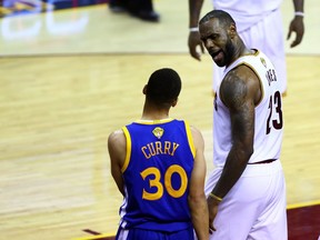 LeBron James lets Steph Curry hear it during Game 6.