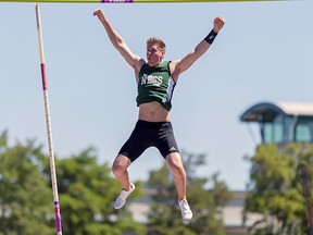 Nanaimo District's Jason Clare clears the bar in pole vault to golden effect Saturday in Nanaimo. (Wilson Wong/UBC athletics photo)