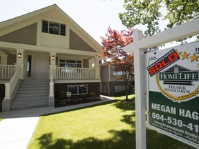 A sold sign is pictured outside a home in Vancouver on Tuesday.