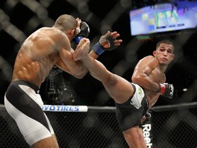 Anthony Pettis kicks Edson Barboza during a lightweight mixed martial arts bout at UFC 197, Saturday, April 23, 2016, in Las Vegas.