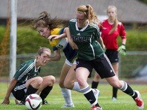 Argyle's Chloe Walton (right) and South Delta's Ava Simpson battle during pool play Thursday at B.C. girls triple-A soccer championships in Tsawwassen. (Gerry Kahrmann, PNG)