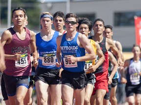 Reynolds Secondary senior Brendan Hoff (sunglasses, front right) helps set the pace in front of the pack with Josh Kozelj (455) of Heritage Woods and Point Grey’s Thomas Nobbs (880) of during 3,000-metre final at the B.C. high school track and field championships Saturday in Nanaimo. (Wilson Wong/UBC athletics photo)