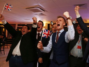 Leave.EU supporters wave Union flags and cheer as the results come in at the Leave.EU referendum party at Millbank Tower in central London early in the morning of June 24, 2016.