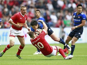 VANCOUVER, BC - JUNE 11:  Pat Parfrey #10 of Canada reaches around Harumichi Tatekawa #12 of Japan as he tries to tackle him during their match at BC Place on June 11, 2016 in Vancouver, Canada.  Japan won 26-22.